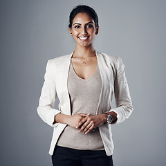 Image showing Smile, professional and portrait of business woman in studio for mindset, natural or confidence. Happy, corporate and career with face of female employee on grey background for manager and pride