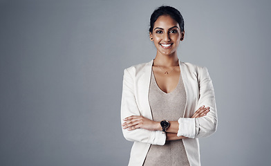 Image showing Space, arms crossed and portrait of business woman in studio for professional, natural and mockup. Happy, corporate and career with face of female employee on grey background for manager and pride