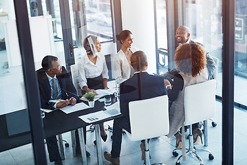 Image showing Teamwork, meeting and business people in discussion in office for brainstorming or planning. Collaboration, company and group of corporate employees working on project together in workplace boardroom