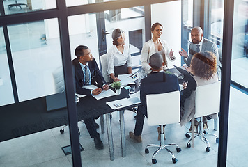 Image showing Conversation, business people and team in a meeting for discussion, brainstorming or planning in office. Teamwork, group and corporate colleagues working on a project together in workplace boardroom.
