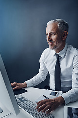 Image showing Typing accountant, computer and mature man in studio, working and isolated on a dark background mockup. Focus, writing and happy manager at desktop for reading email, research or business auditor.