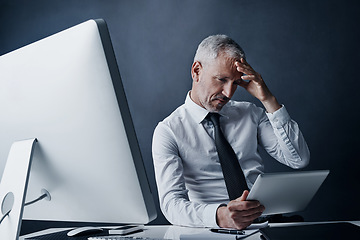 Image showing Tablet, crisis and senior business man in studio isolated on a dark background. Technology, mistake and elderly manager at desk reading email, tax or problem for bankruptcy, debt or fail challenge.