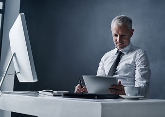 Image showing Tablet, computer and business man at desk online for social media, internet and browse website in office. Network, corporate worker and mature male person on digital tech, writing notes and planning