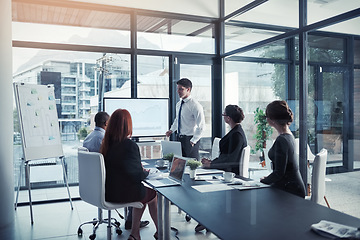 Image showing Presentation, training and team building meeting for a report or corporate workshop in a startup company. Board, manager and business man or speaker talking about growth or development strategy