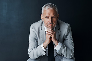 Image showing Serious portrait of senior attorney sitting with confidence, mockup space and dark background in studio. Pride, professional career ceo and executive lawyer man, mature businessman or law firm boss.