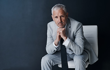 Image showing Serious portrait of senior lawyer on chair with confidence, mockup space and dark background in studio. Pride, professional career ceo and executive attorney, mature businessman or law firm boss.