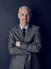 Image showing Smile, confidence and studio portrait of businessman in suit, arms crossed and pride on dark background. Boss, ceo and happy business owner with professional career, senior model executive with job.