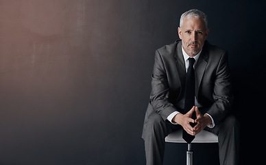 Image showing Mock up, chair and serious portrait of lawyer, attorney or businessman with confidence on dark background in studio space. Boss, ceo or business owner, proud senior executive director at law firm.