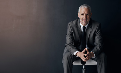 Image showing Mock up, chair and happy portrait of lawyer, attorney or businessman with confidence on dark background in studio space. Boss, ceo or business owner with smile, senior executive director at law firm.