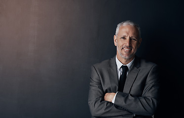 Image showing Portrait, smile and businessman with mockup, confident lawyer or attorney on dark background in studio. Boss, ceo and professional business owner, happy senior director at law firm with arms crossed.