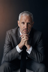 Image showing Serious portrait of senior lawyer, confident businessman or legal advisor in suit on dark background in studio. Boss, ceo or business owner with pride, senior executive director or law firm attorney.