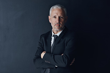 Image showing Senior executive, business man and arms crossed with confidence in portrait and management on dark background. Male CEO, corporate director and suit with ambition, empowerment and career in studio