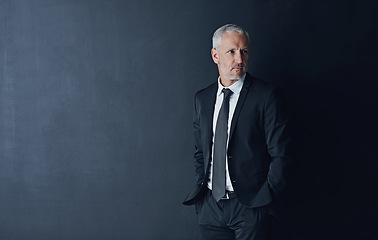 Image showing Senior executive, business man and confidence in studio, management and professional mindset on dark background. Male CEO, corporate director and suit with ambition, empowerment and mockup space