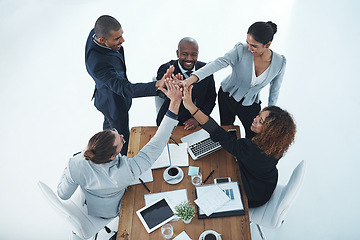 Image showing High five, happy and above of business people in meeting with support, teamwork and motivation. Smile, target and a group of corporate employees with together hands for collaboration and achievement