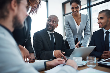 Image showing Meeting, talking and business people with laptop in office for planning, strategy and collaboration. Corporate, teamwork and men and women in discussion working on report, group project and proposal