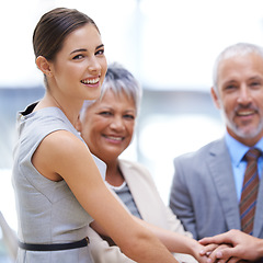 Image showing Portrait, business woman and hands together for collaboration, smile and solidarity. Group, teamwork and community huddle of employees for support, mission or cooperation for goals in partnership.