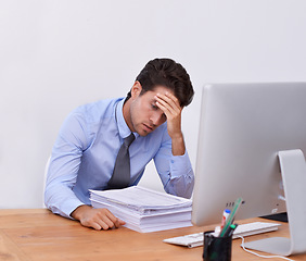 Image showing Stress, business man and headache with paperwork from corporate career at office desk. Anxiety, lawyer deadline and burnout of a male professional with notes, contracts and report with fatigue