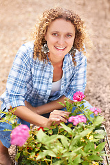 Image showing Happy, portrait and a woman gardening in nature for sustainability, ecology care and inspection. Smile, spring and a florist or girl with plants or flowers in a backyard or garden for lawn design