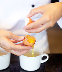 Image showing Baker, hands and separate eggs for yolk, white and preparation for cooking, dessert or meal in kitchen job. Professional pastry chef, start work or ready ingredients for process, cake or food at cafe