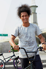 Image showing Portrait, bmx and man with bicycle in city, outdoor and training in street. Cycling, funny or person laugh with bike to travel in Brazil for sport, exercise or workout for fitness, health or wellness