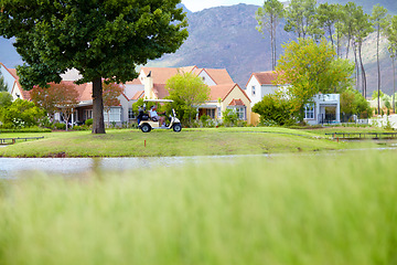 Image showing Golf cart, people or golfers driving on course in fitness workout or exercise together by club house. Driver, grass field or active person golfing or training in sports game hobby in nature outdoors