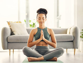 Image showing Meditation, praying hands and woman relax on living room floor for peace, wellness or mental health at home. Prayer pose, yoga and lady meditate in lounge for zen, peace or holistic breathe exercise