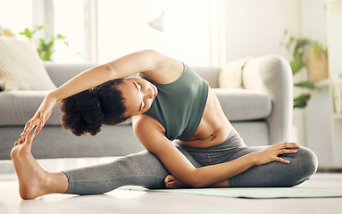 Image showing Stretching, yoga and woman on a living room floor for training, exercise or mental health at home. Legs, stretch and lady with flexible fitness or pilates workout for balance, meditation or wellness