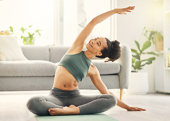 Image showing Stretching, happy woman and yoga on living room floor, training or mental health exercise at home. Arm, stretch and lady with flexible fitness or pilates, workout or balance, meditation or wellness