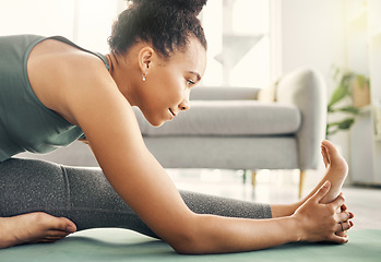 Image showing Body, stretching and yoga by woman on living room floor, training or mental health exercise at home. Leg, stretch and lady with flexible fitness or pilates, workout or balance, meditation or wellness