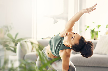 Image showing Yoga, wellness and woman at home with zen, relax and arm stretching for health in a living room. Young female person, apartment and lounge with pilates and flexibility exercise in house feeling calm