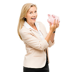 Image showing Happy woman, portrait and piggy bank for money savings or investment isolated on a white studio background. Excited female person with piggybank for coins, budget finance or cash on mockup space