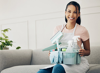 Image showing Woman, cleaning tools and smile in portrait, chemical spray and hygiene with household maintenance product. Happy female cleaner, janitor supplies in basket and clean house, service and detergent