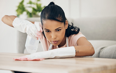 Image showing Woman, chemical spray and cleaning wooden table, hygiene with household maintenance and detergent. Female cleaner, disinfectant and wipe or clean dirt with cloth from surface and janitor service