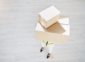 Image showing Delivery, courier person and boxes or package from above for logistics, cargo or shipping industry. A worker or employee with cardboard box or parcel from supply chain for distribution service mockup