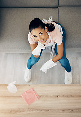 Image showing Happy, cleaning portrait and a woman in a house to clean with supplies, chemical and cloth. Above young female or cleaner in a lounge, apartment or room with a smile to polish wood or wipe dirt