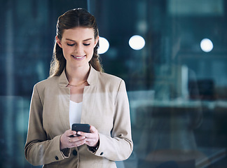 Image showing Phone, night or happy businesswoman on social media texting or typing an email in online conversation. Office, mobile app or girl employee on web chat for blog post or networking on late break at job