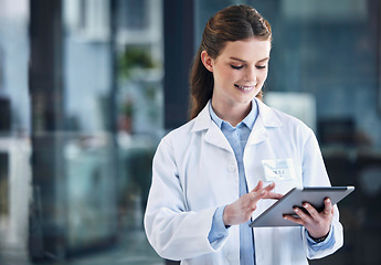 Image showing News, tablet or happy doctor in hospital with research on online media to search for medicine info. Woman, smile or medical healthcare professional browsing on technology for telehealth in clinic