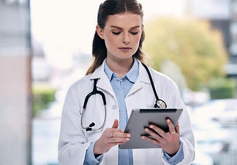 Image showing Tablet, woman or doctor in hospital with research to search for medicine web info on social media. Telehealth, scroll or medical healthcare professional reading or browsing on app to chat in clinic