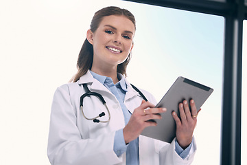 Image showing Tablet, happy woman or portrait of doctor in hospital with research to search for medicine on social media. Telehealth, scroll or medical healthcare professional browsing on app to chat in clinic