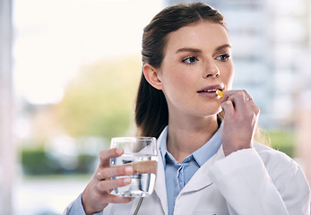 Image showing Doctor, drinking water or woman in hospital with pills or supplements for healthcare vitamins or medicine. Stress, medication tablets or sick medical worker taking drugs for depression or headache