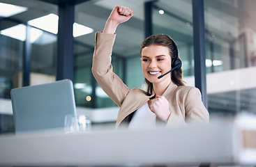 Image showing Happy woman, laptop and fist in call center for celebration, winning or victory and bonus promotion at office. Female person, consultant or agent in joy for achievement, discount or sale at workplace