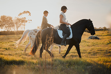 Image showing Horse riding, countryside and hobby with friends in nature on horseback through a field during a summer morning. Freedom, equestrian and female riders outdoor together for travel, fun or adventure