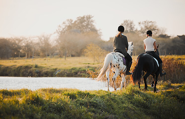 Image showing Horseback riding, freedom and friends in nature by the lake during a summer morning with a view. Countryside, equestrian and female riders bonding outdoor together for wilderness travel or adventure
