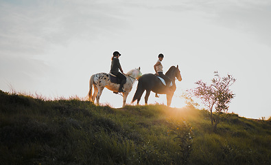 Image showing Horse riding, sunset or hobby with friends the countryside on horseback looking at the view during a summer morning. Nature, equestrian and female riders outdoor together for travel fun or adventure