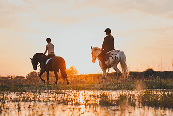 Image showing Horseback, women and friends by lake in countryside at sunset with outdoor mockup space. Equestrian, girls and animals in water, nature and adventure to travel, journey or summer vacation together