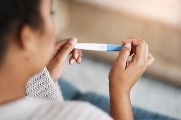 Image showing Pregnancy test, woman hands and waiting at home for results on a living room couch. House, female person and hand with testing stick to show pregnant sign while checking alone on lounge sofa
