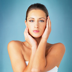 Image showing Skincare, cosmetics and beauty, portrait of woman with dermatology and makeup on blue background. Shine, skin care and wellness, fresh face of model with beauty and facial glow on studio backdrop.