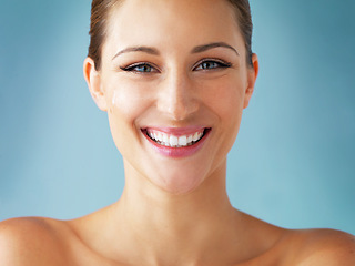 Image showing Skin care, cosmetics and smile, portrait of woman with dermatology and makeup on blue background. Happiness, skincare and wellness, happy face of model with beauty and facial glow on studio backdrop.
