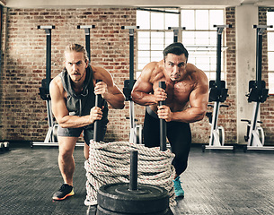 Image showing Men, weights exercise and together with sled, rope and strong for fitness, health and training on floor. Body builder partnership, friends and teamwork for workout, coaching and muscle development