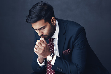 Image showing Business, thinking or Indian man with anxiety, fail or consultant against a dark studio background. Male person, employee or agent with stress, mistake or financial report with depression or confused